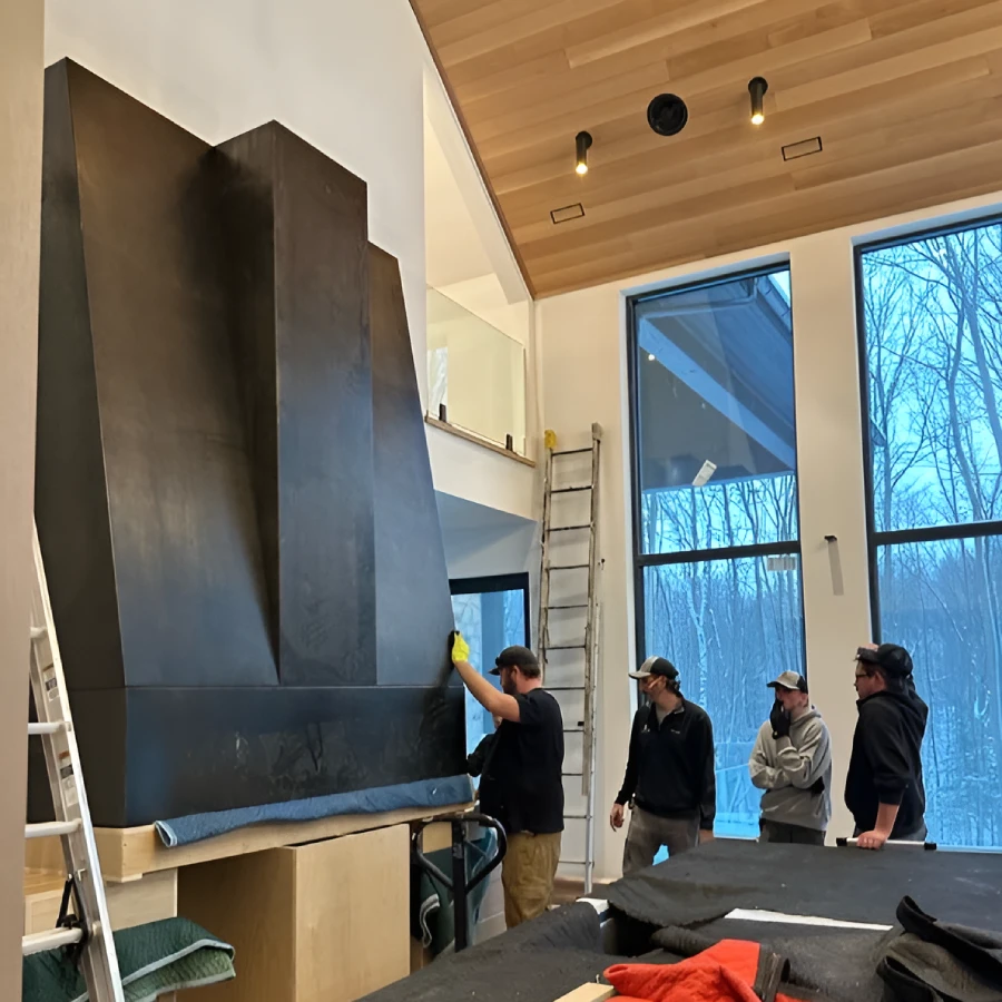 custom blackened metal range hood