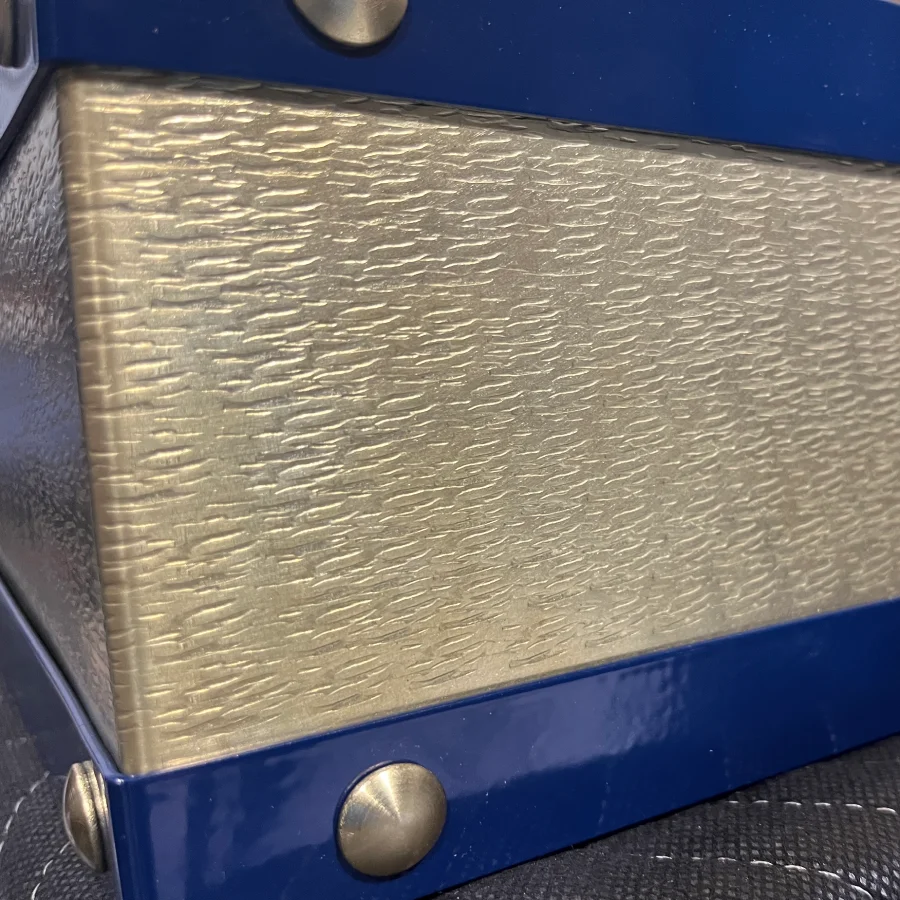 custom range hood with hammered brass trims